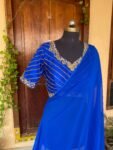 Blue silk saree with hand embroidered blouse